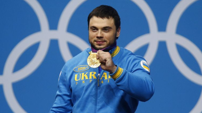 Oleksijs Torohtijs svin Londonas OS zelta medaļu 2012. gadā. Foto: Reuters/Scanpix